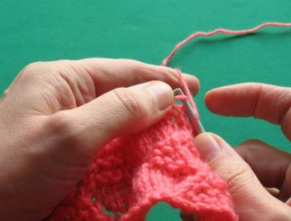 Slip first stitch knitwise – notice the yarn over on the right hand needle.